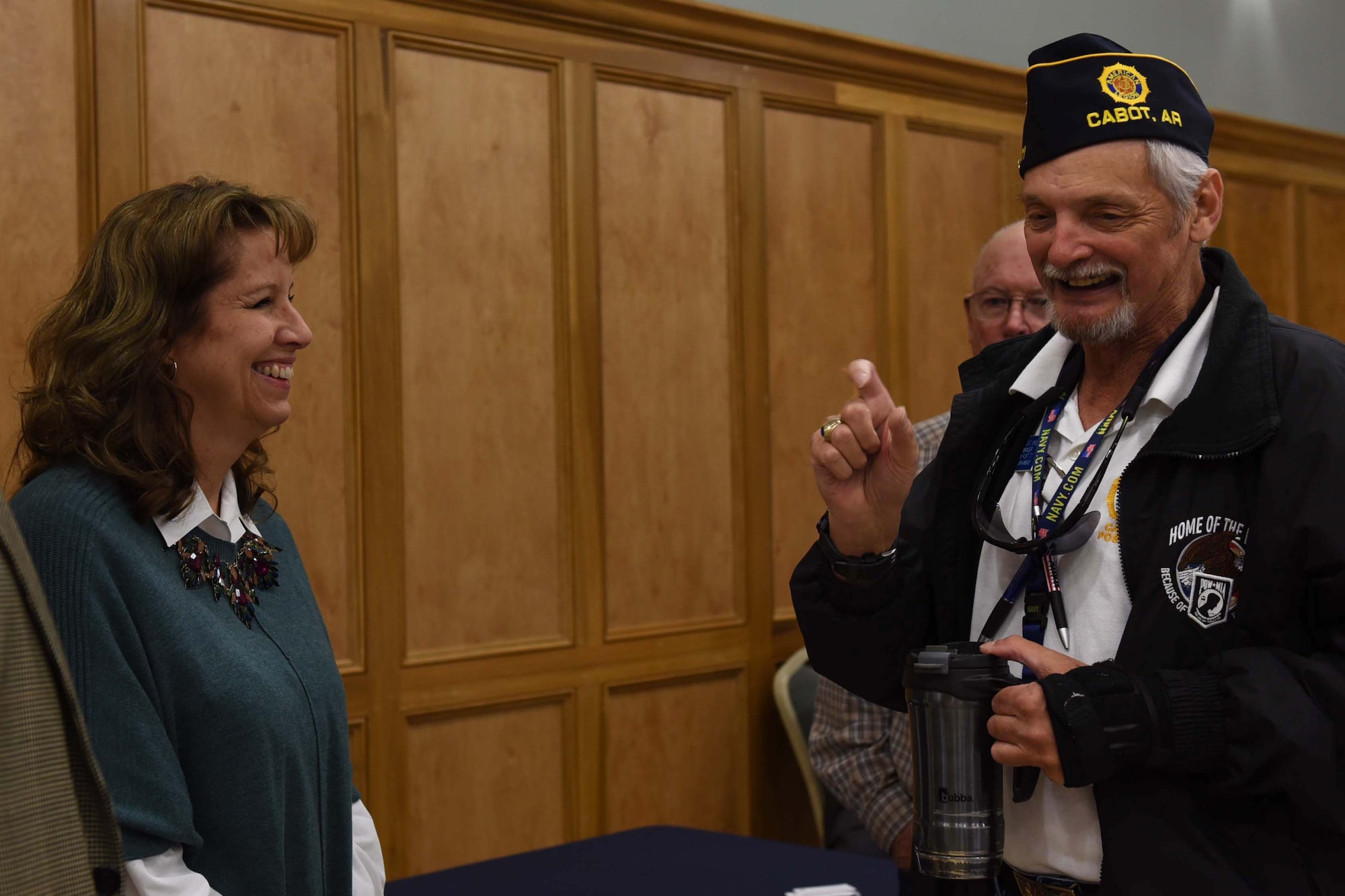 A woman and man smile together