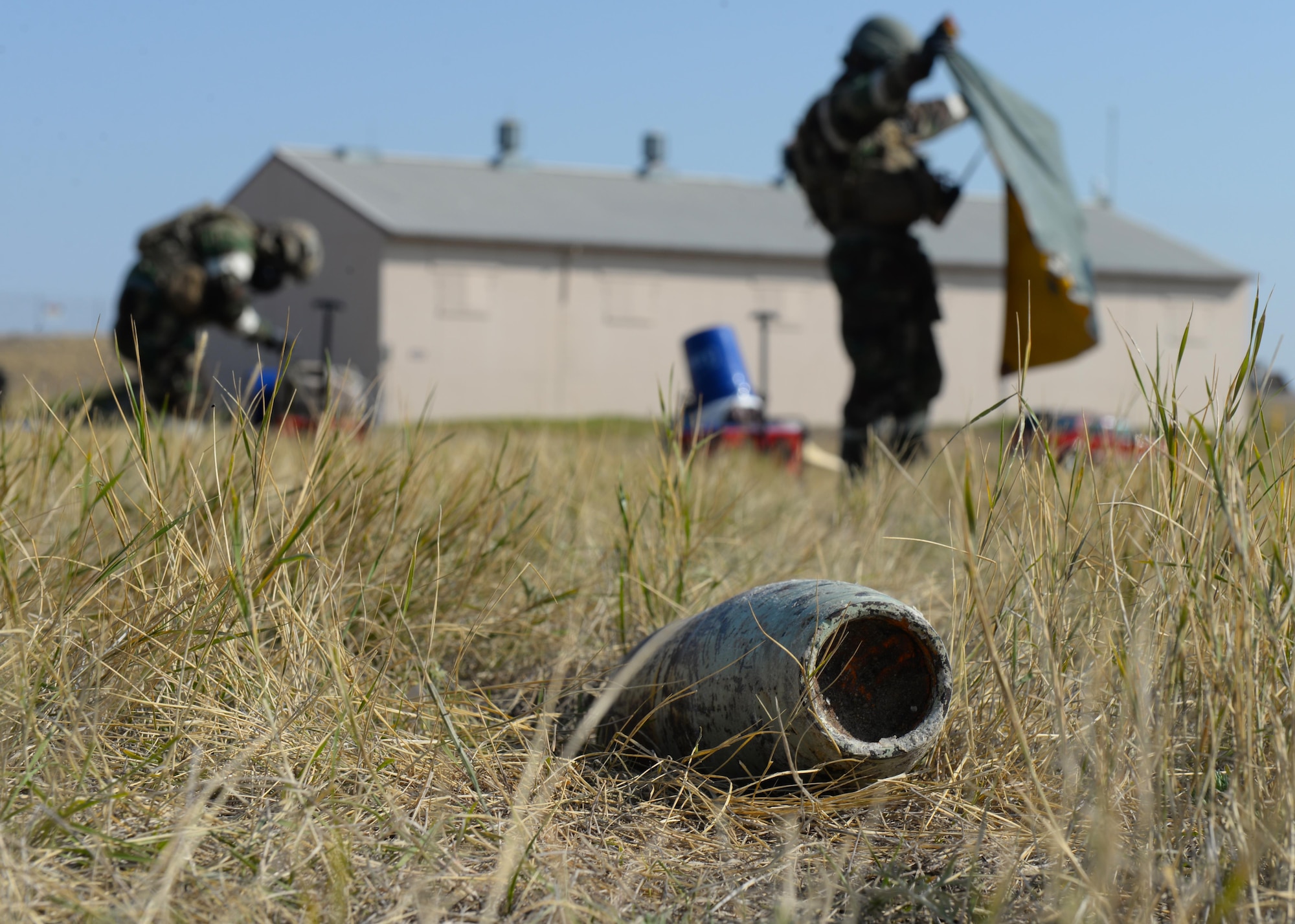 Senior Airmen Christopher Camille and Parker Davis, explosive ordnance disposal technicians assigned to the 28th Civil Engineer Squadron, build a decontamination station during an EOD Team of the Year competition at Ellsworth Air Force Base, S.D., Sept. 12, 2017. The decontamination scenario was the only non-timed event out of eight scenarios that occurred during the competition. (U.S. Air Force photo by Airman Nicolas Z. Erwin)