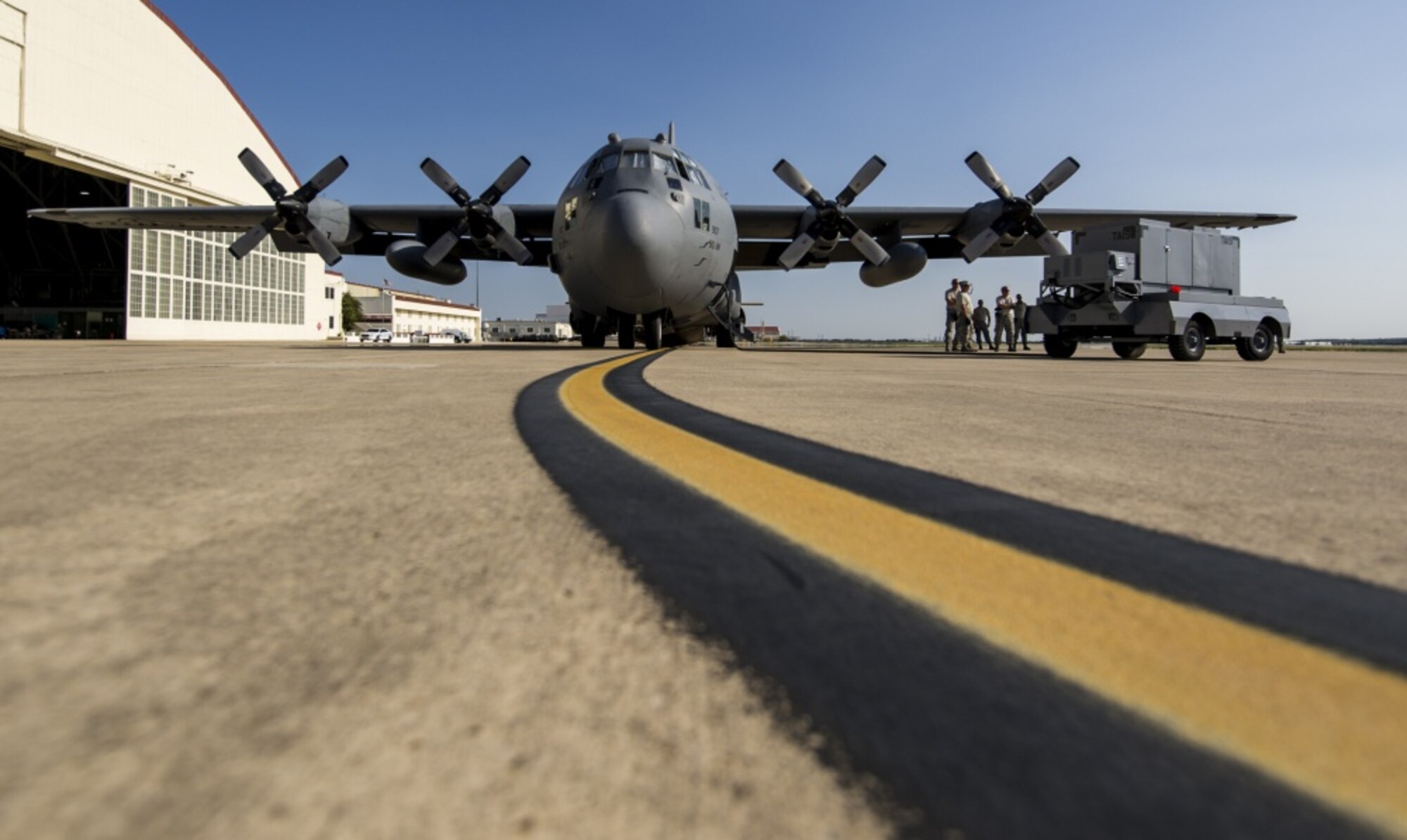 U.S. Airmen with the 910th Airlift Wing, Youngstown Air Reserve Station, Ohio, prepare a C-130H Hercules for an aerial spray mission over the area effected by Hurricane Harvey, Sept. 12, 2017, at Joint Base San Antonio-Kelly Field Annex, Texas.