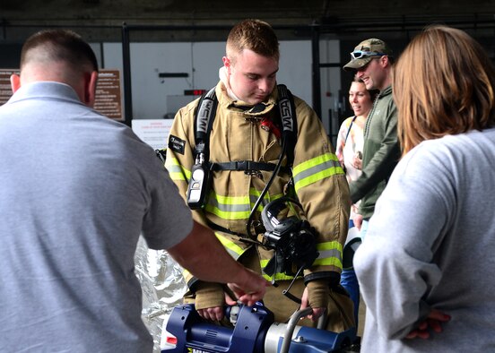 Airman 1st Class Bradyn McIntosh-Oldaker, a firefighter assigned to the 28th Civil Engineer Squadron, demonstrates the Hurst Jaws of Life during a Base Appreciation Day at Ellsworth Air Force Base, S.D., Sept. 16, 2017. The fire department, along with other base agencies set up display tables for event participants to learn more about how they all contribute to the base mission. (U.S. Air Force photo by Senior Airman Denise M. Jenson)