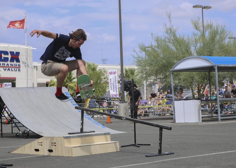 Garret Hill, professional skater and X Games athlete, performs a no comply backslide boardslide during the X Games Action Sports Show at the Marine Corps Exchange parking lot aboard the Combat Center, Twentynine Palms, Calif., September 9, 2017. The X Games Action Sports Show was a one day event where professional skaters and BMX riders provided entertainment for Marines, sailors and their families. (U.S. Marine Corps photo by Lance Cpl. Christian Lopez)