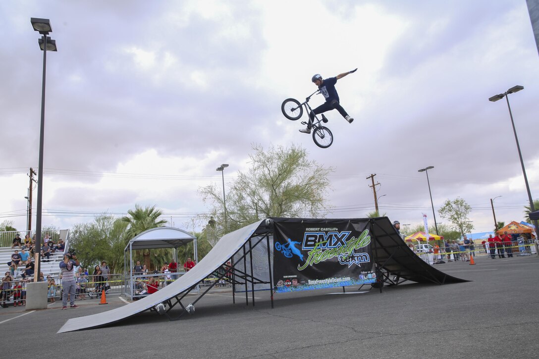 Dustin McCarty, professional BMX rider and X Games athlete, performs a nothing during the X Games Action Sports Show at the Marine Corps Exchange parking lot aboard the Combat Center, Twentynine Palms, Calif., September 9, 2017. The X Games Action Sports Show was a one day event where professional skaters and BMX riders provided entertainment for Marines, sailors and their families. (U.S. Marine Corps photo by Lance Cpl. Christian Lopez)