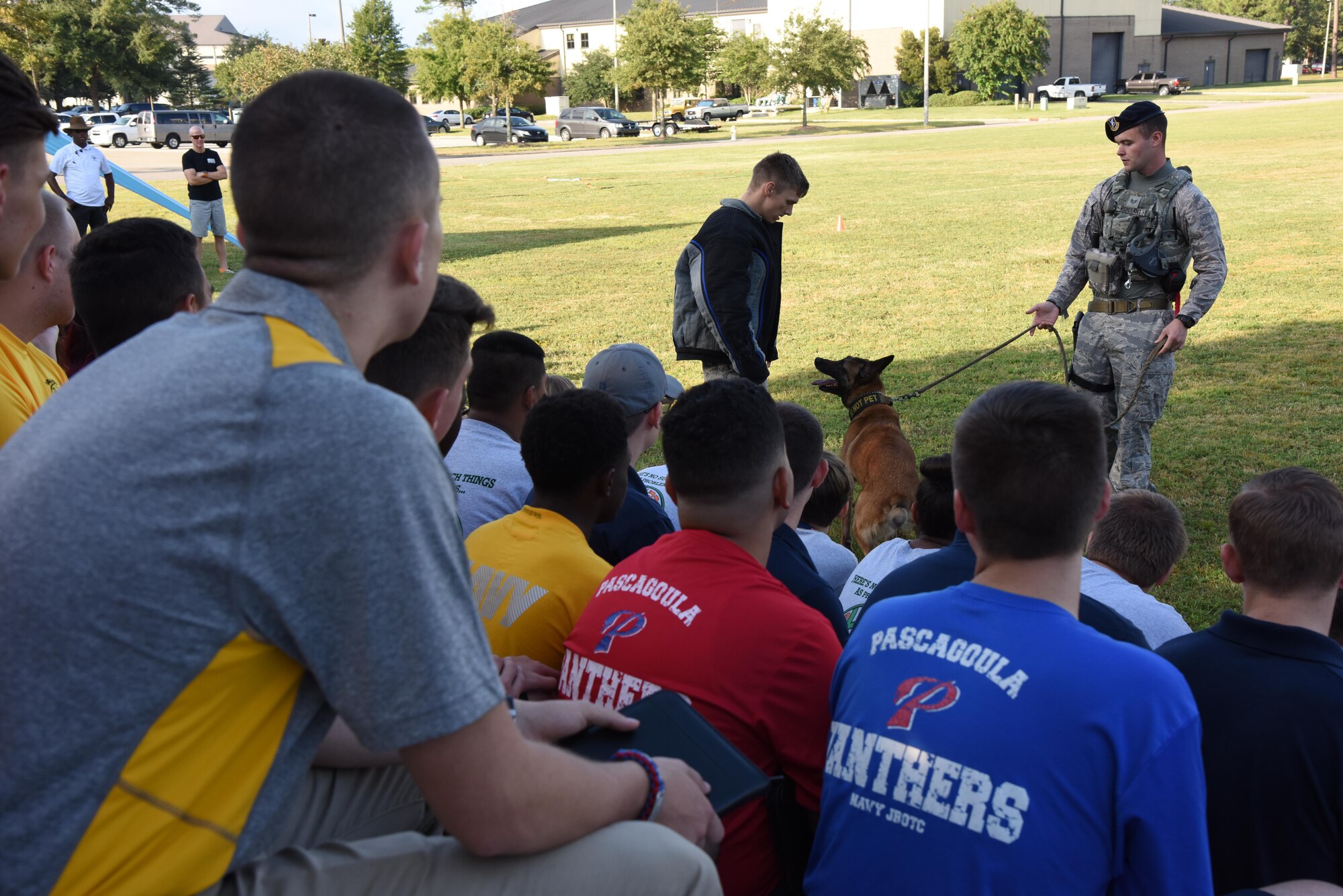 Members of the 81st Security Forces Squadron perform a military working dog demonstration at the Science, Technology, Engineering and Mathematics Diversity Outreach Day Sept. 15, 2017, on Keesler Air Force Base, Mississippi. The event consisted of 10 Mississippi gulf coast high school Junior ROTC units receiving information about Air Force opportunities and accession requirements with an emphasis on STEM. They also competed in several team building activities. (U.S. Air Force photo by Kemberly Groue)