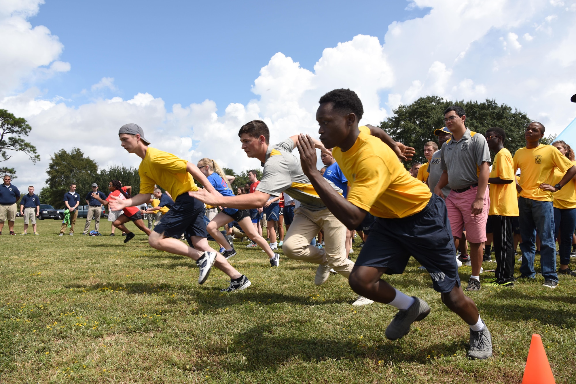 Local high school Junior ROTC cadets begin a relay race at the Science, Technology, Engineering and Mathematics Diversity Outreach Day Sept. 15, 2017, on Keesler Air Force Base, Mississippi. The event consisted of 10 Mississippi gulf coast high school Junior ROTC units viewing an 81st Security Forces Squadron military working dog demonstration and receiving information about Air Force opportunities and accession requirements with an emphasis on STEM. They also competed in several team building activities. (U.S. Air Force photo by Kemberly Groue)