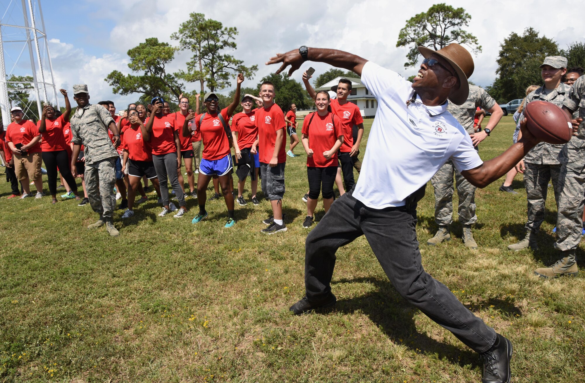 Retired Master Sgt. Steve Hinton, Biloxi High School instructor, competes in the football throwing competition at the Science, Technology, Engineering and Mathematics Diversity Outreach Day Sept. 15, 2017, on Keesler Air Force Base, Mississippi. The event consisted of 10 Mississippi gulf coast high school Junior ROTC units viewing an 81st Security Forces Squadron military working dog demonstration and receiving information about Air Force opportunities and accession requirements with an emphasis on STEM. They also competed in several team building activities. (U.S. Air Force photo by Kemberly Groue)