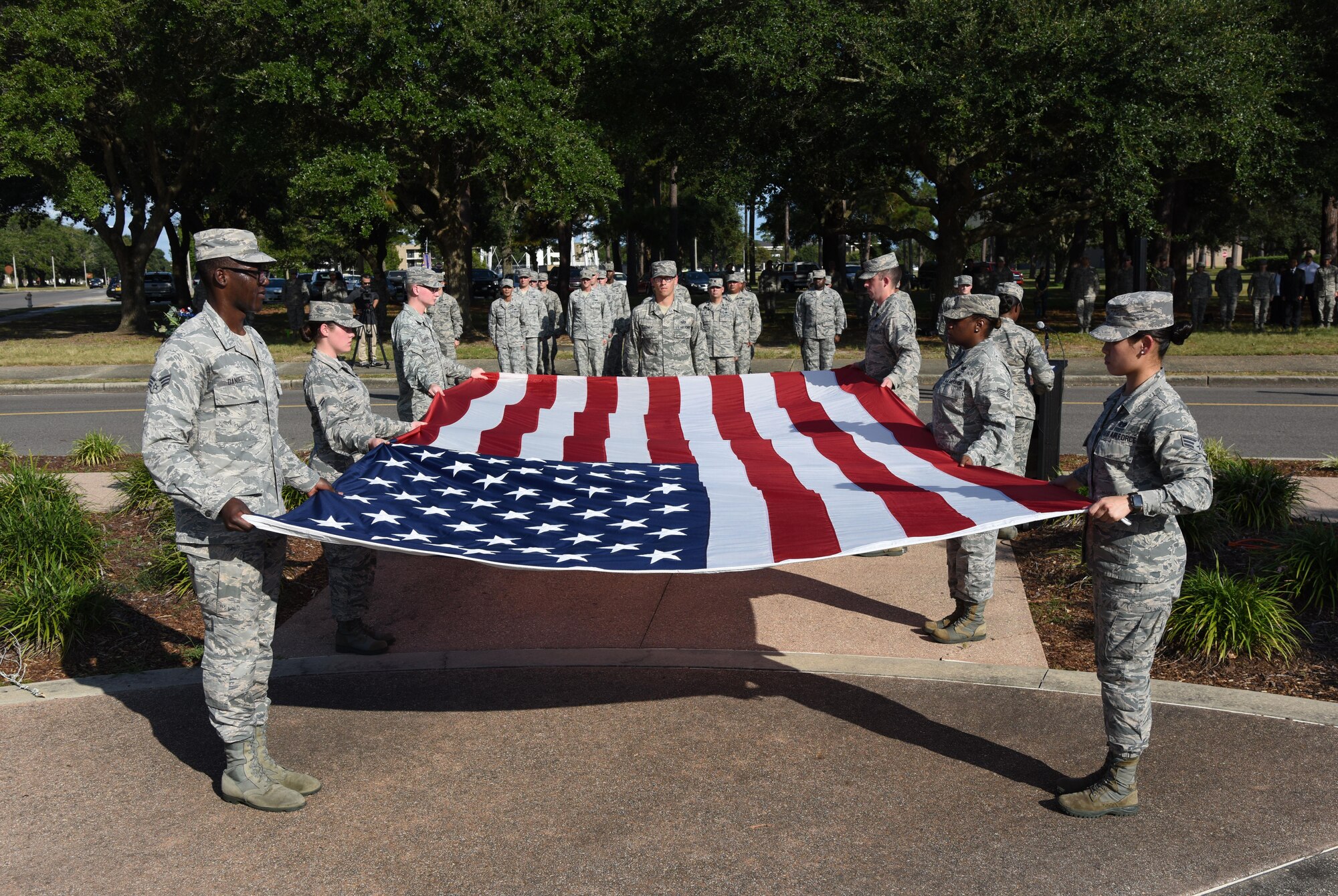 Keesler personnel participate in a flag folding ceremony during the POW/MIA Retreat Ceremony Sept. 15, 2017, on Keesler Air Force Base, Mississippi. The event, hosted by the Air Force Sergeants Association Chapter 652, was held to raise awareness and pay tribute to all prisoners of war and military members still missing in action. (U.S. Air Force photo by Kemberly Groue)