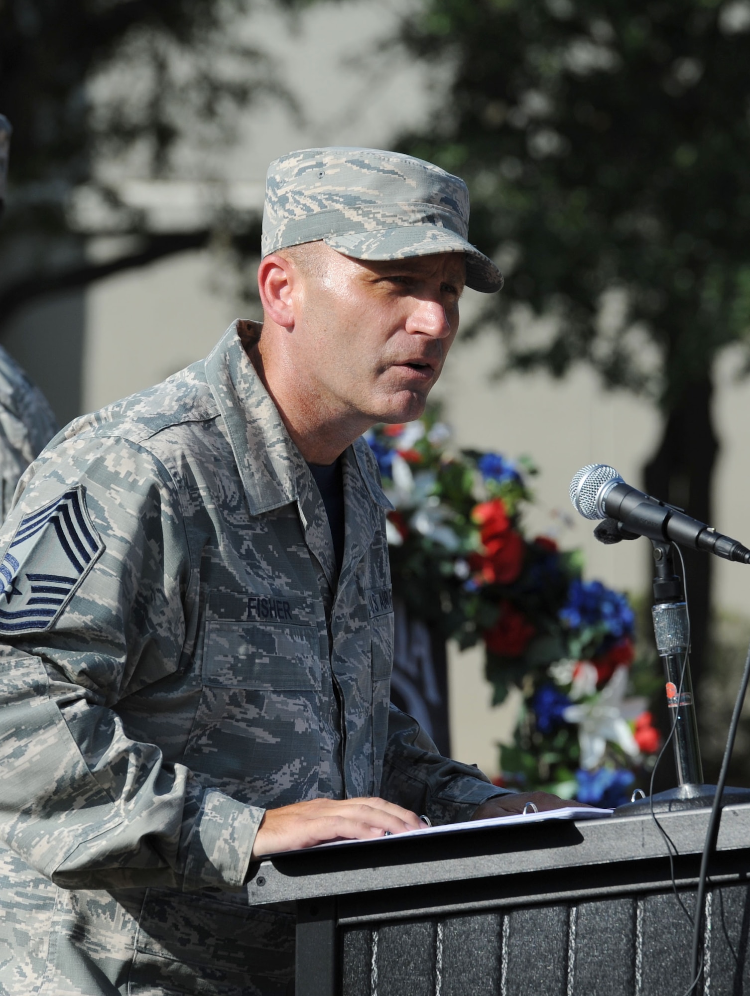 Chief Master Sgt. Anthony Fisher, 81st Training Group superintendent, delivers remarks during the POW/MIA Retreat Ceremony Sept. 15, 2017, on Keesler Air Force Base, Mississippi. The event, hosted by the Air Force Sergeants Association Chapter 652, was held to raise awareness and pay tribute to all prisoners of war and military members still missing in action. (U.S. Air Force photo by Kemberly Groue)