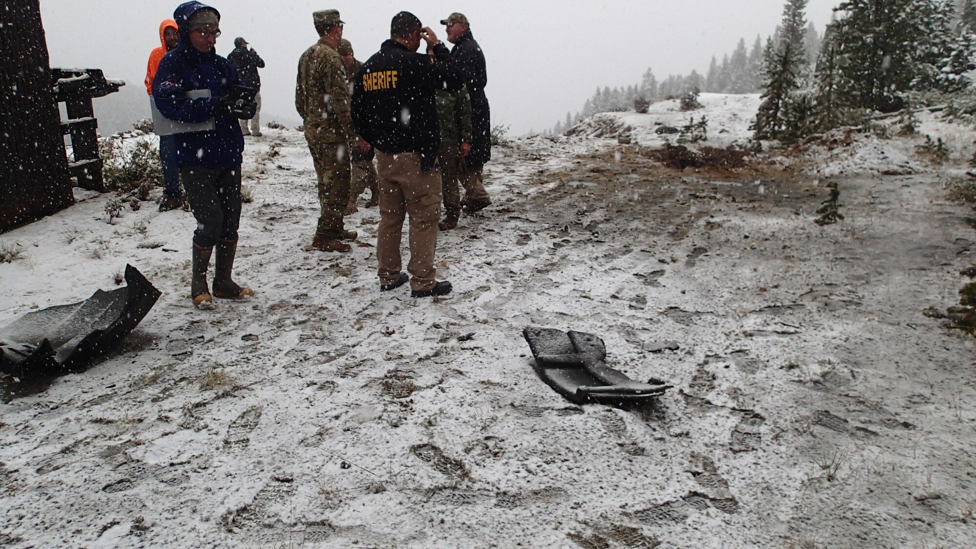 341st Civil Engineer Squadron explosive ordnance disposal Airmen coordinate with teams from the U.S. States Environmental Protection Agency and Cascade County Sheriff Department before a controlled detonation of explosive chemicals Sept. 14, 2017, in Neihart, Mont. (Courtesy photo)