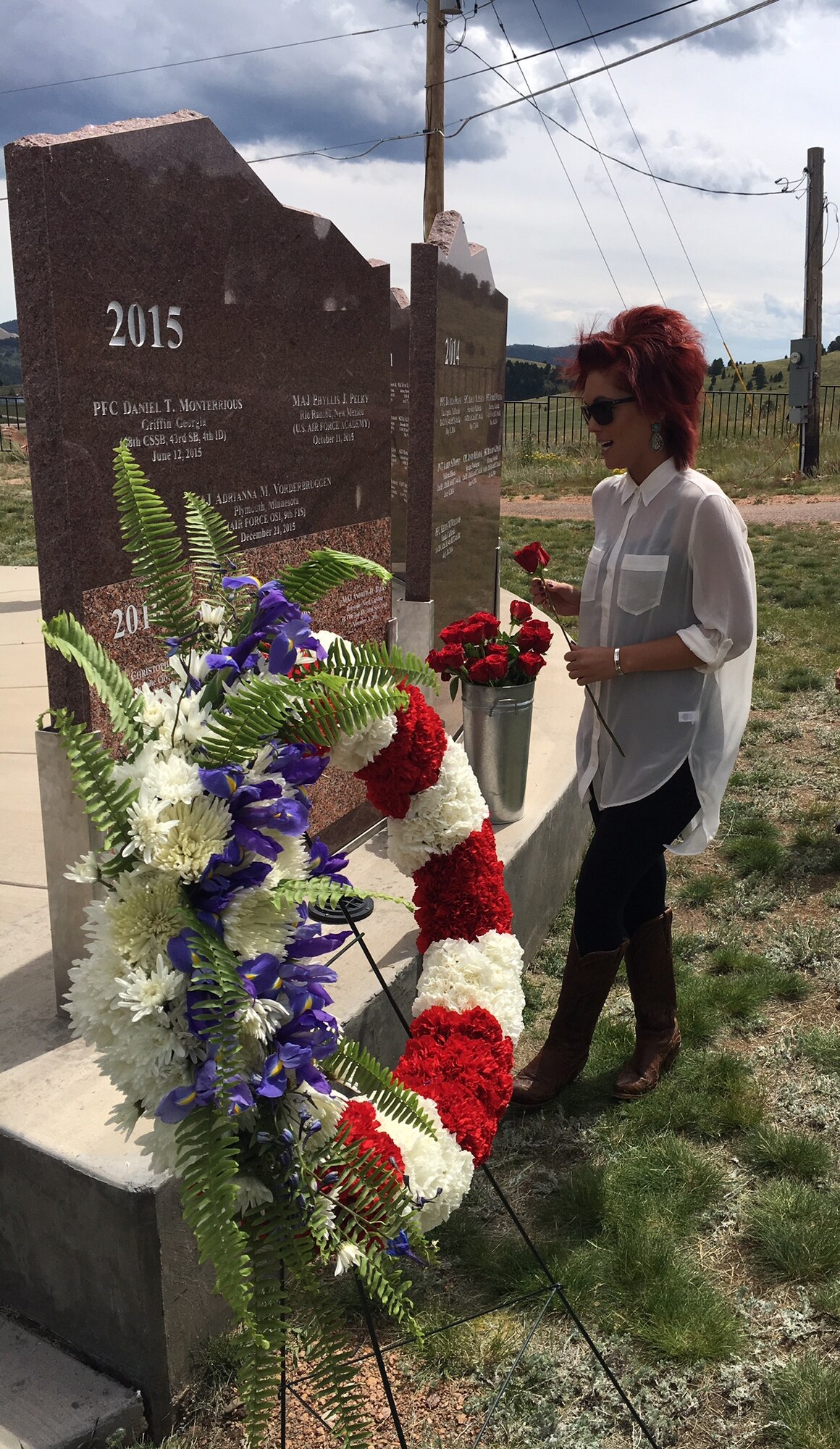 Rachel Bieren, wife of the late Staff Sgt. Austin Bieren, 4th Space Control Squadron physical security NCOIC, participates in a ceremony honoring her husband and four service members from the 21st Space Wing and the 10th Special Forces Brigade, who lost their lives in the line of duty. The event was held at Mount Pisgah Cemetery in Cripple Creek, Colorado, August 20, 2017. (Courtesy photo)