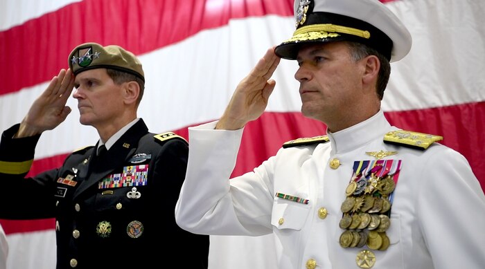 Vice Adm. John Aquilino and Gen. Joseph L. Votel salute during a change of command ceremony for U.S. Naval Forces Central Command (NAVCENT)/U.S. 5th Fleet/Combined Maritime Forces.