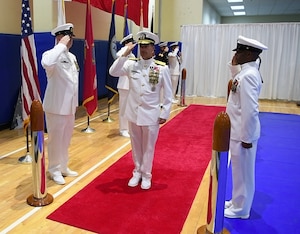 Vice Adm. John Aquilino salutes side boys during a change of command ceremony for U.S. Naval Forces Central Command (NAVCENT)/U.S. 5th Fleet/Combined Maritime Forces.