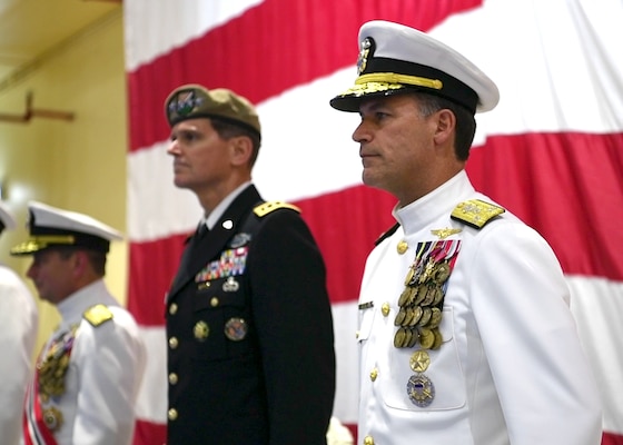Vice Adm. John Aquilino, right, Gen. Joseph L. Votel, middle, and Vice Adm. Kevin Donegan stand at attention during a change of command ceremony for U.S. Naval Forces Central Command (NAVCENT)/U.S. 5th Fleet/Combined Maritime Forces.