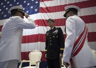 Vice Adm. John Aquilino salutes Gen. Joseph L. Votel to as he takes command of U.S. Naval Forces Central Command (NAVCENT)/U.S. 5th Fleet/Combined Maritime Forces from Vice Adm. Kevin Donegan.