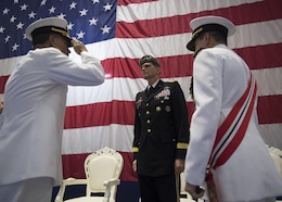 Vice Adm. John Aquilino salutes Gen. Joseph L. Votel to as he takes command of U.S. Naval Forces Central Command (NAVCENT)/U.S. 5th Fleet/Combined Maritime Forces from Vice Adm. Kevin Donegan.