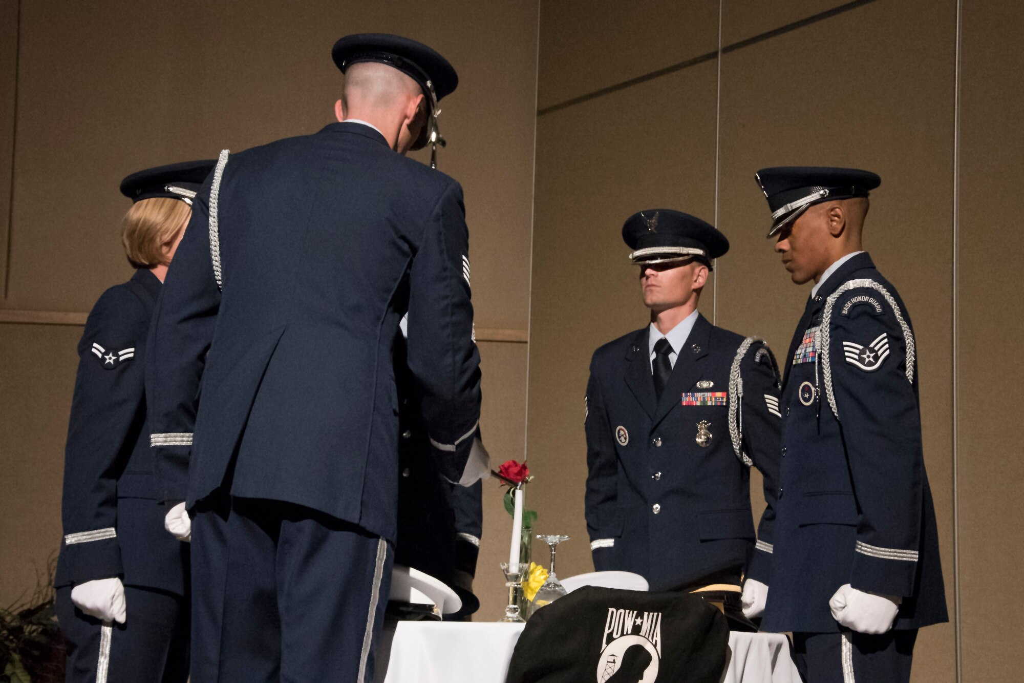 The Honor Guard sets the Prisoners of War / Missing in Action table at the Air Force ball at the McNease Convention Center in San Angelo, Texas, Sept. 15, 2017. The table is full of special symbols to remind us of those lost in service. (U.S. Air Force photo by Airman Zachary Chapman/Released)