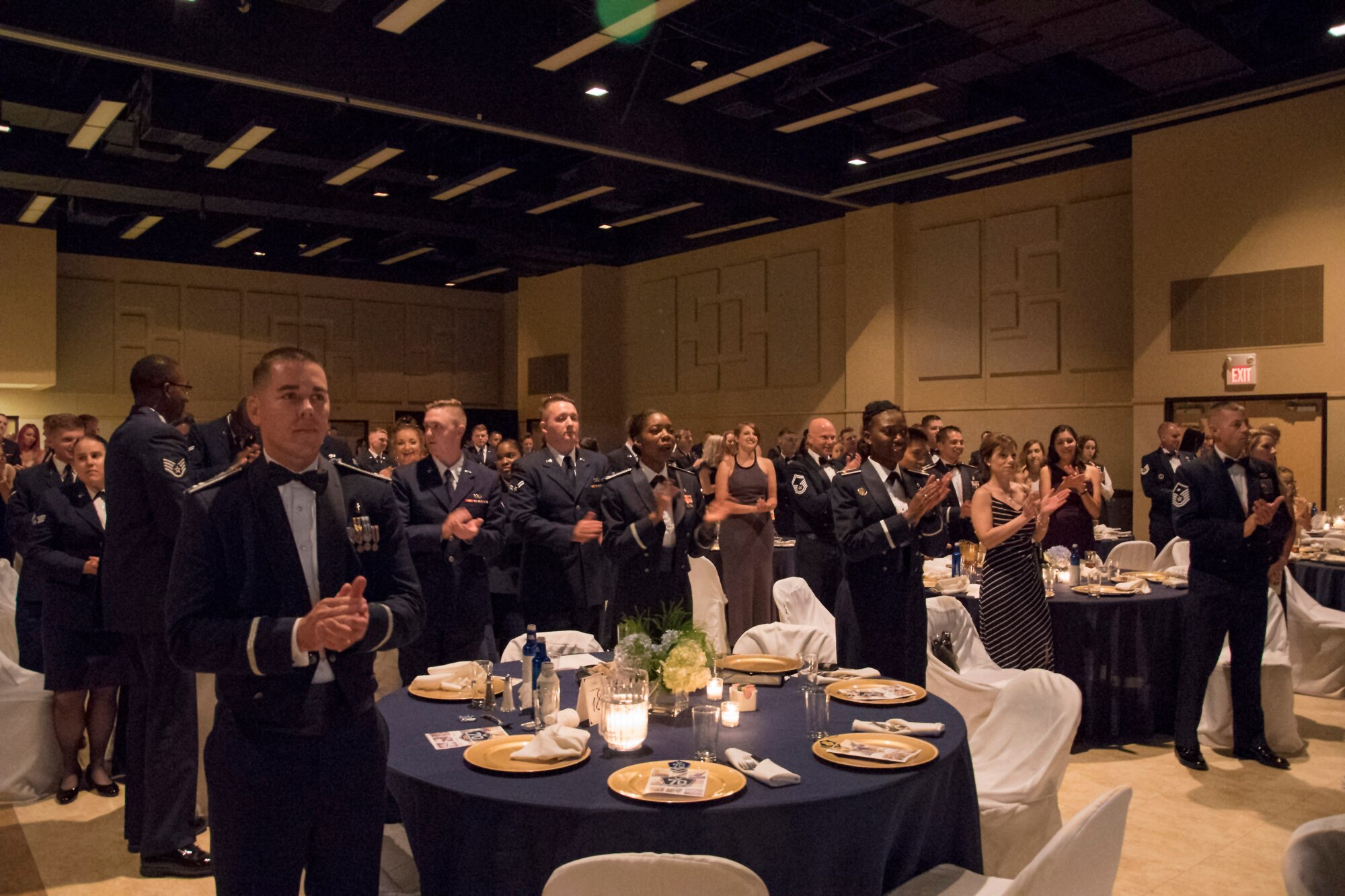 Guests sing the Air Force song and celebrate the closing of the Air Force Ball held at the McNease Convention Center in San Angelo, Texas, Sept. 15, 2017. The Air Force Ball focused on tradition and honoring the past and promoting the future. (U.S. Air Force photo by Airman Zachary Chapman/Released)