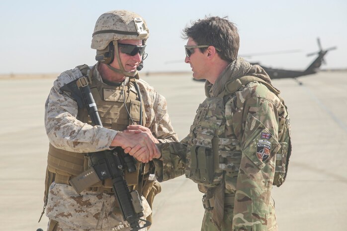 Brig. Gen. Roger Turner, the commanding general for Task Force Southwest, greets British Army Maj. Gen. Charles Herbert, the Resolute Support senior advisor to the Minister of Interior, at Bastian Airfield, Afghanistan, Sept. 11, 2017. The purpose of the visit for the Afghan Minister of Interior  was an introduction to the leadership of 505th Zone National Police and an opportunity to meet some of the MOI forces at Bost Airfield. (U.S. Marine Corps photo by Sgt. Lucas Hopkins)