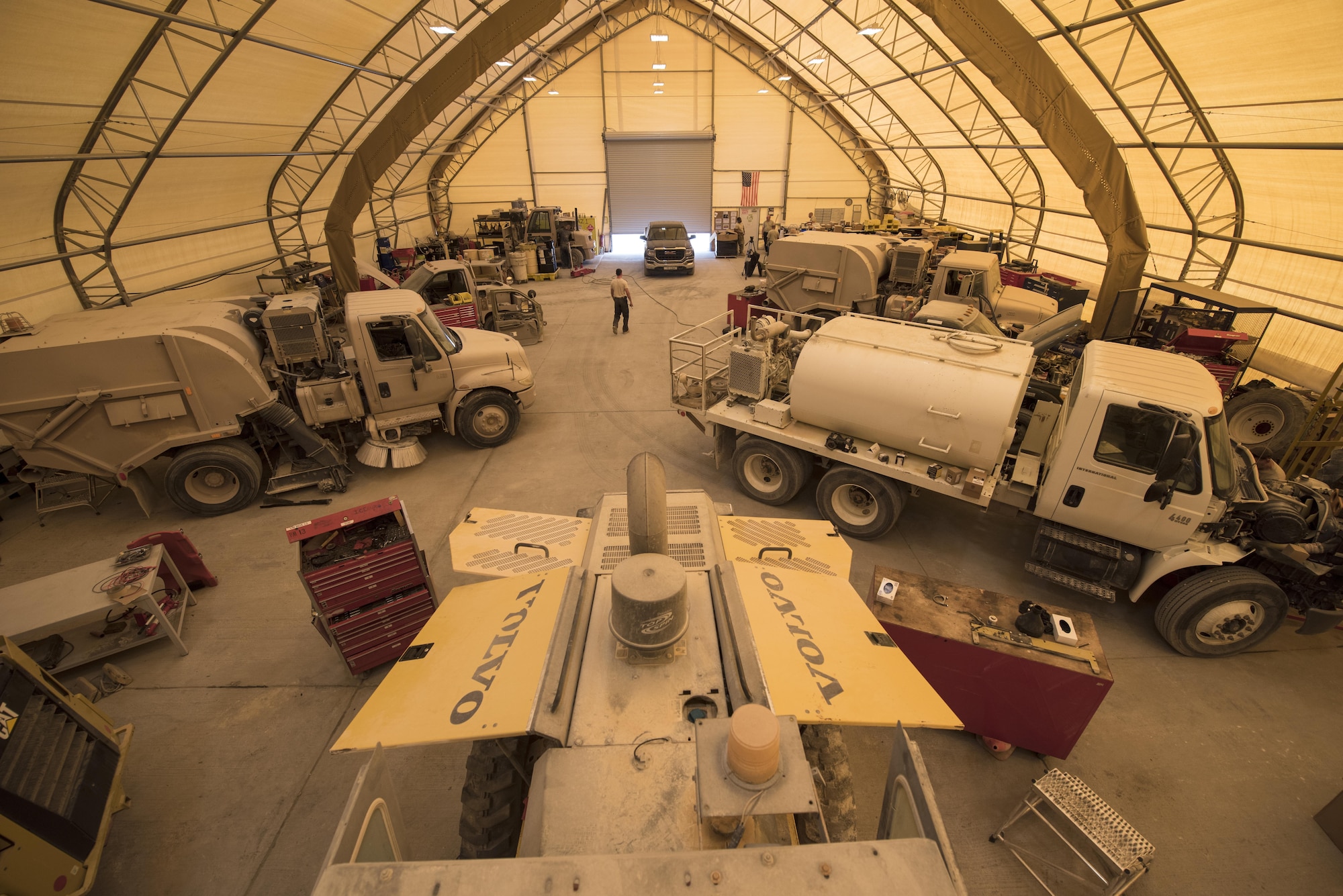 Airmen assigned to the 332nd Expeditionary Logistics Readiness Squadron perform maintenance and repairs on a variety of vehicles, Sept. 14, 2017, in Southwest Asia. The small number of Airmen assigned to the 332nd ELRS Vehicle Maintenance flight are responsible for everything from basic maintenance to major overhauls on more than 300 vehicles operated across the installation. (U.S. Air Force photo by Senior Airman Joshua Kleinholz)