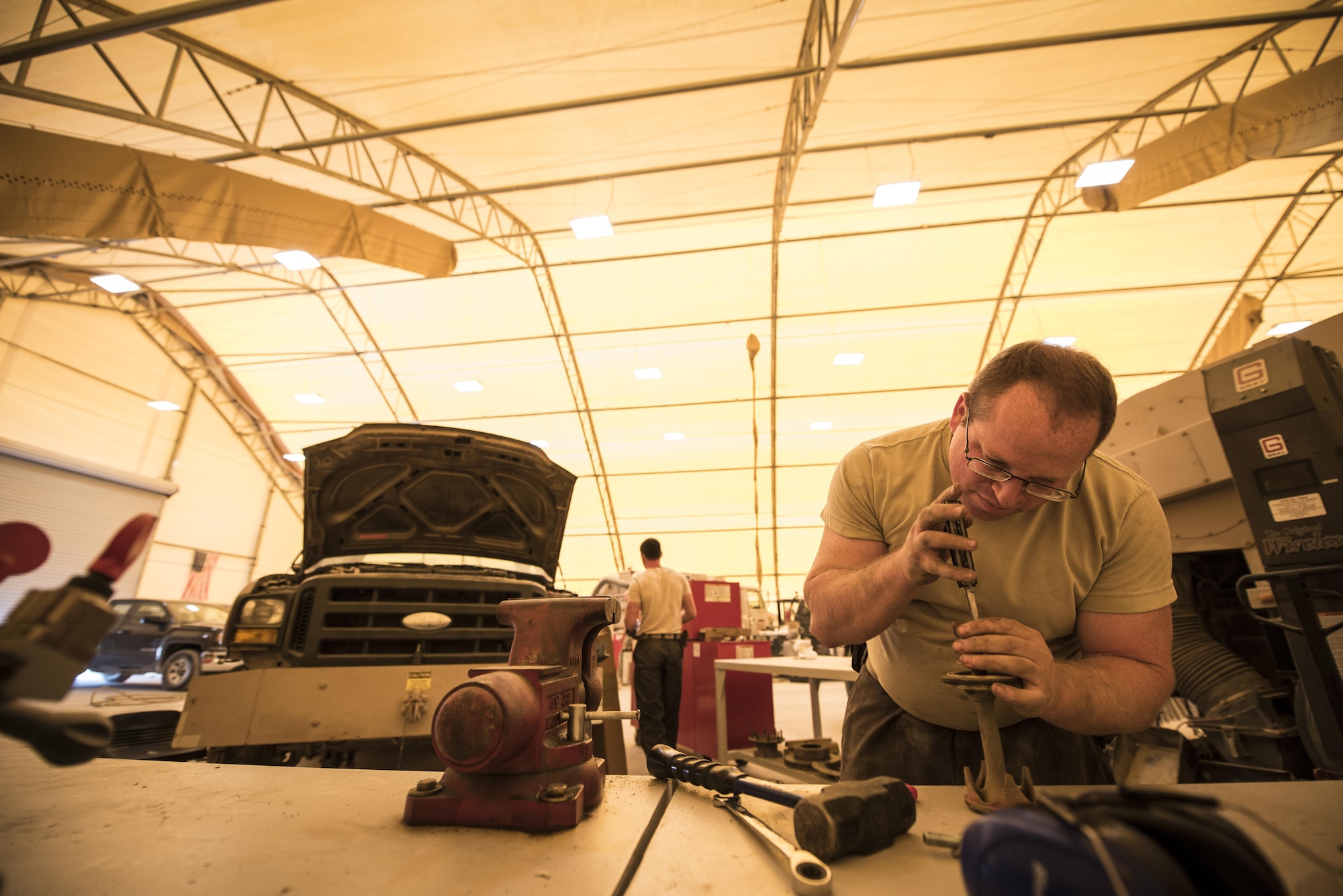 Airmen assigned to the 332nd Expeditionary Logistics Readiness Squadron perform maintenance and repairs on a variety of vehicles, Sept. 14, 2017 in Southwest Asia. Maintainers are trained to inspect, diagnose and repair a multitude of different common and specialty Air Force vehicles.  (U.S. Air Force photo by Senior Airman Joshua Kleinholz)