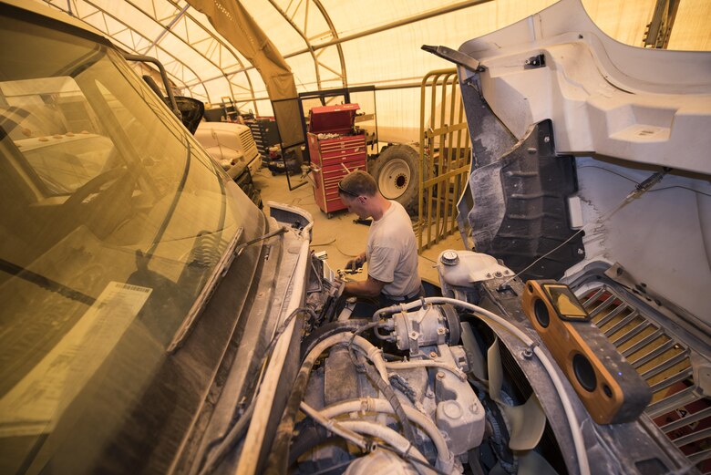 Staff Sgt. Ryan Clark, 332nd Expeditionary Logistics Readiness Squadron vehicle maintainer, replaces parts on a large diesel engine, Sept. 14, 2017 in Southwest Asia. In some cases, 332nd ELRS Airmen perform full vehicle overhauls and engine swaps, often with limited resources and time constraints. (U.S. Air Force photo by Senior Airman Joshua Kleinholz)