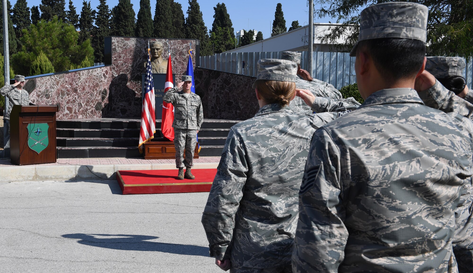 Airmen assigned to the 425th Air Base Squadron render a salute to Lt. Col. Christopher Collins, incoming 425th ABS commander, during an Assumption of Command at Izmir Air Station, Turkey, Sept. 18, 2017. Collins was previously assigned to the 451st Flying Training Squadron as a combat systems instructor. (U.S. Air Force photo by Senior Airman Jasmonet D. Jackson)