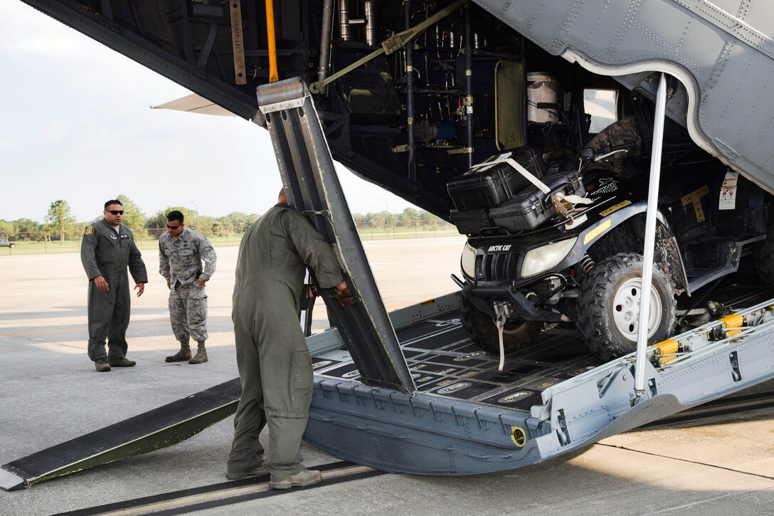 An airman prepares to remove hurricane response equipment