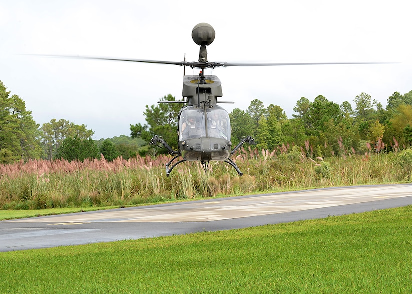 John Zimmerman, Aviation Development Directorate Aviation Support Facility manager, bows the OH-58D “Kiowa Warrior” during its final flight at Joint Base Langley-Eustis, Va., Sept. 18, 2017.