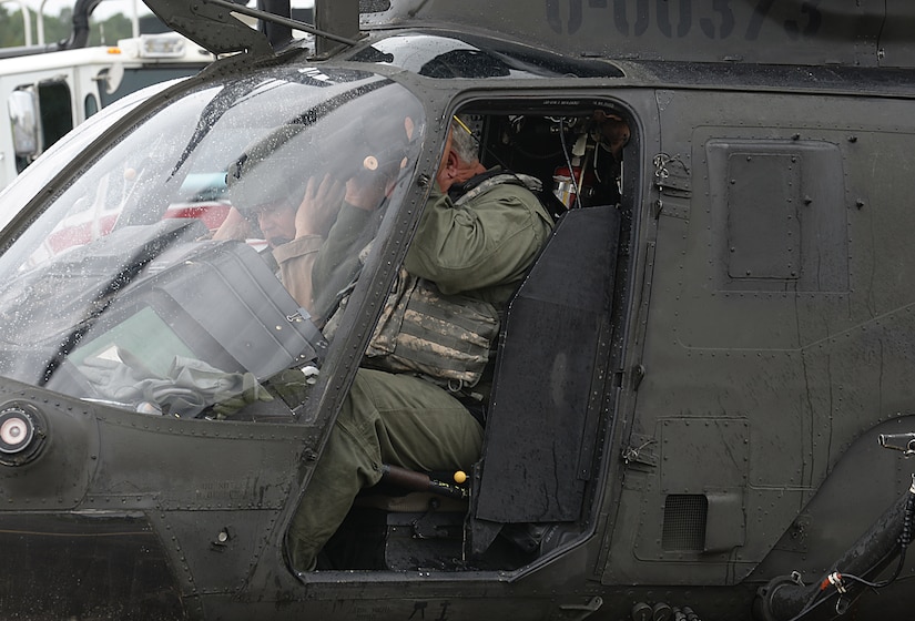 John Zimmerman, Aviation Development Directorate Aviation Support Facility manager, and Joseph Shaw, ADD aircraft mechanic, prepare to exit an OH-58D “Kiowa Warrior” after its final flight at Joint Base Langley-Eustis, Va., Sept. 18, 2017.