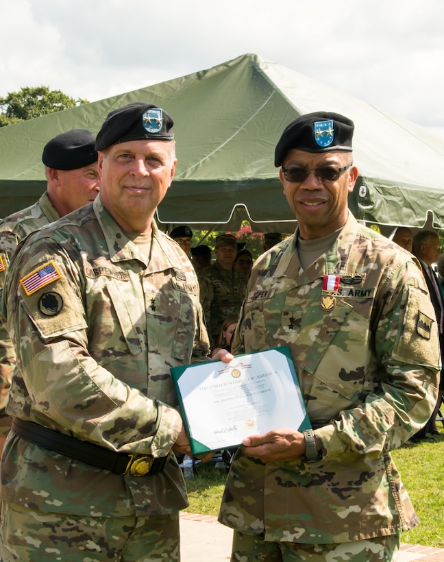 (Left) Deputy Commanding General of the U.S. Army Reserve Command Maj. Gen. Scottie D. Carpenter presents outgoing Commander of the 80th Training Command Maj. Gen. A.C. Roper with the Distinguished Service Medal at the 80th's change of command ceremony at Fort Lee, Virginia, Sept. 17, 2017.