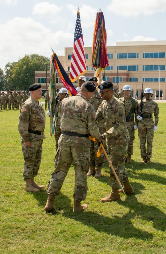 (Right) Outgoing Commander of the 80th Training Command Maj. Gen. A.C. Roper hands the unit's colors to Deputy Commanding General of the U.S. Army Reserve Command Maj. Gen. Scottie D. Carpenter at the 80th's change of command ceremony at Fort Lee, Virginia, Sept. 17, 2017.