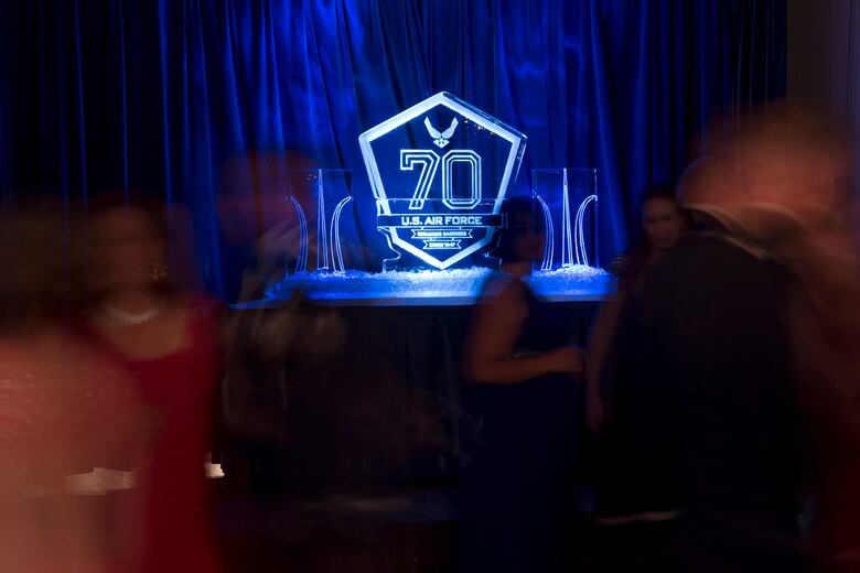 An engraved ice sculpture representing the 70th birthday of the Air Force sits on the stage during the Air Force Ball at Peterson Air Force Base, Colorado, Sept. 15, 2017. The Air Force Ball ended the night with music and dancing. (U.S. Air Force photo by Senior Airman Dennis Hoffman)