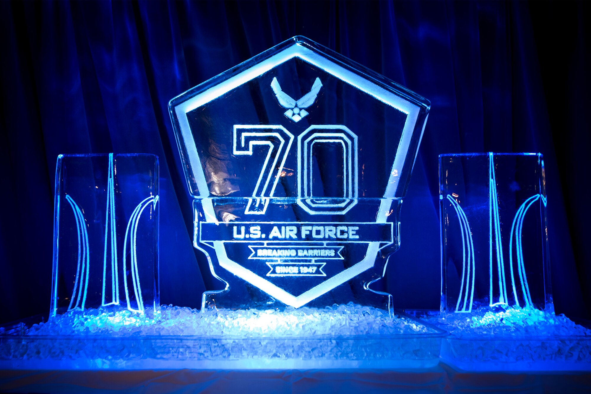 An engraved ice sculpture representing the 70th birthday of the Air Force sits on the stage during the Air Force Ball at Peterson Air Force Base, Colorado, Sept. 15, 2017. The Air Force Ball ended the night with music and dancing. (U.S. Air Force photo by Senior Airman Dennis Hoffman)