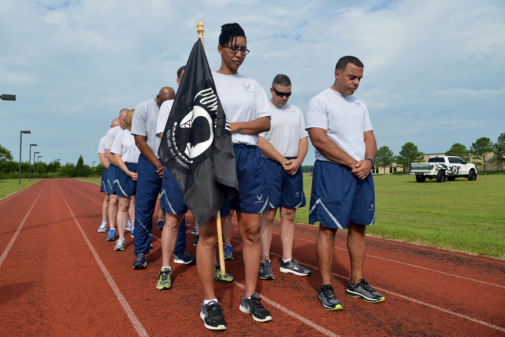 U.S. Air Force Airmen bow their heads prior to the start of the POW/MIA 24-hour vigil run at Joint Base Langley-Eustis, Va., Sept. 14, 2017.