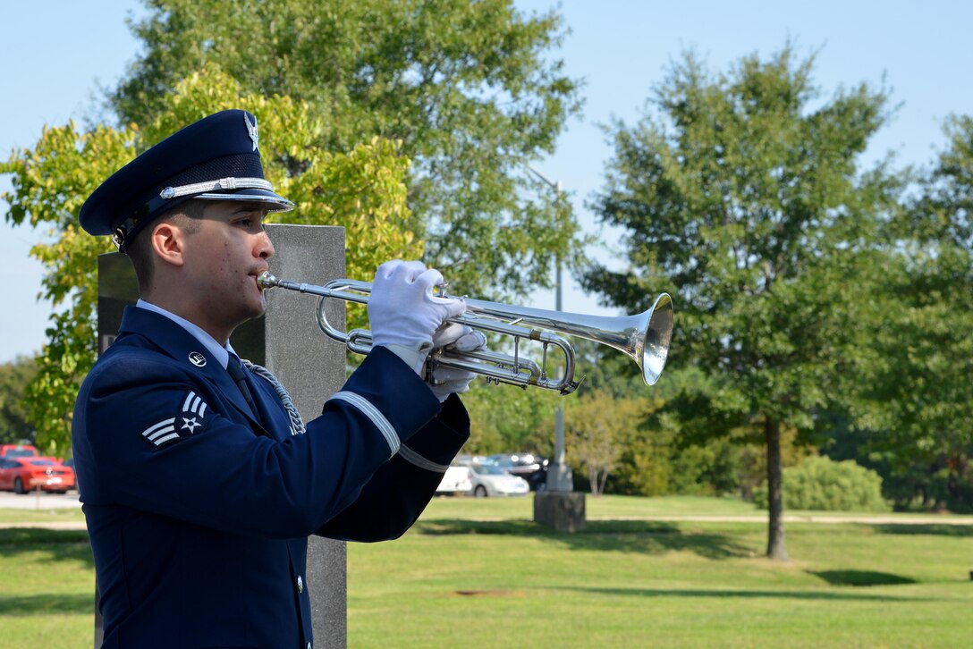 U.S. Air Force Senior Airman Gabriel M. Fox, Langley Honor Guard member, plays music during the POW/MIA Recognition Day ceremony at Joint Base Langley-Eustis, Va., Sept. 15, 2017.