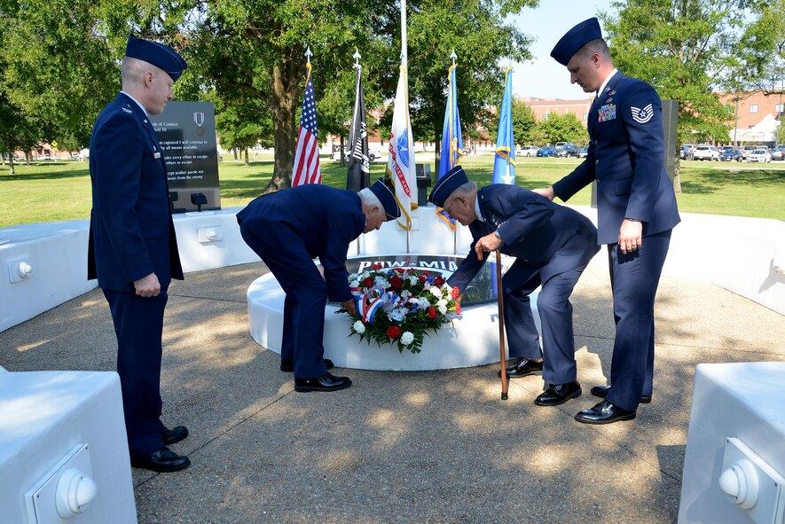 (From center left) U.S. Retired Lt. Gen. Glen Moorhead III and U.S. Air Force Retired Brig. Gen. Richard Abel place a wreath on the memorial in observance of National POW/MIA Recognition Day at Joint Base Langley-Eustis, Va., Sept. 15, 2017.