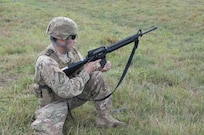 Sgt. 1st Class Martin Braden, of Meridian, Idaho, team leader and a combat engineer with the 688th Engineer Company, Harrison, Arkansas, loads and prepares to fire an M-16A2 rifle at Fort McCoy, Wisconsin.