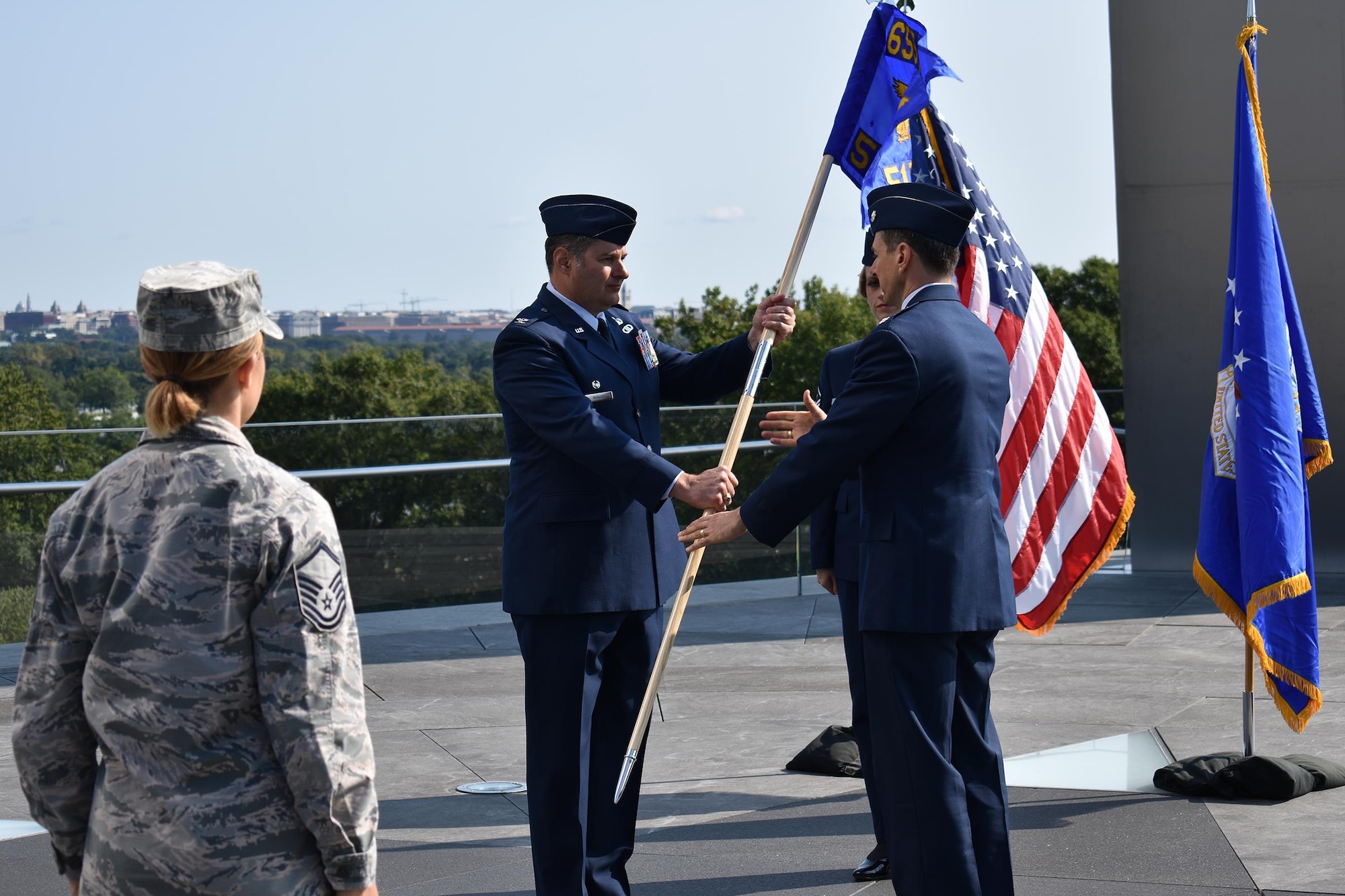 Lt. Col. Todd A. Borzych (right) assumes command of the 512th Cyber Intelligence Squadron,  655th Intelligence, Surveillance and Reconnaissance Group, by accepting the squadron flag from Col. John D. McKaye, 655th ISRG commander, during a formal ceremony September 10, 2017, at the Air Force Memorial in Arlington, Virginia. The 512th IS officially activated on September 2, 2017 along with the 655th ISRG 23rd IS (Cyber), Texas, and 820th IS (Targeting), Nebraska. (U.S. Air Force photo by Maj. John T. Stamm)