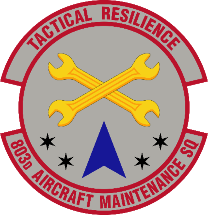 The 803rd Aircraft Maintenance Squadron Patch was recently approved by Air Force Reserve Command. Blue alludes to the sky, the primary theater of Air Force operations. Yellow refers to the sun and the excellence required of Air Force personnel. Gray suggests the standard military aircraft color, which is the foundational resource that leads the Air Force in flying, flight and winning. The wrenches symbolize quality maintenance, which is key to providing safe and reliable resources to combatant commanders. The delta denotes the primary tool for delivering airpower -- the military aircraft. The six-pointed stars, two on each side of the delta, signify the initial driving force of the first weapon system the maintainers of the unit work on – six-bladed turbo-propellers. (U.S. Air Force graphic)
