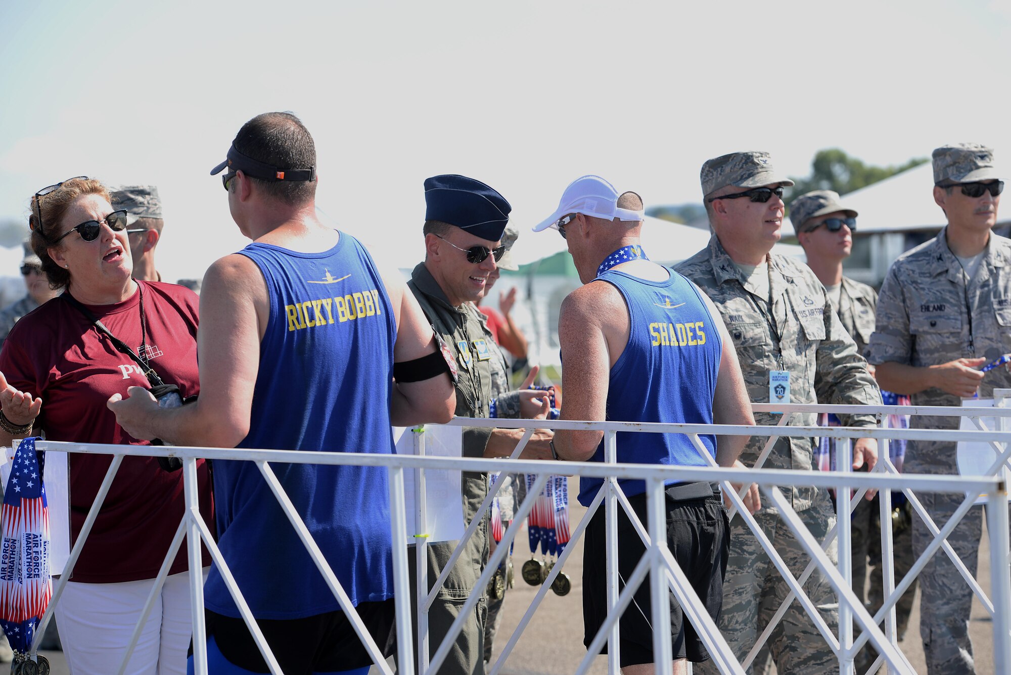 Maj. Robert Young, 43rd Flying Training Squadron instructor pilot, and Lt. Col. Derek Oakley, 41st Flying Training Squadron Commander, receive their medals after the Air Force Marathon Sept. 16, 2017, on Wright-Patterson Air Force Base, Ohio. Oakley finished with a time of 4:35:43. Young finished with a time of 4:33:20. (U.S. Air Force photo by Airman 1st Class Keith Holcomb)