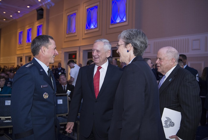 From left, Air Force Chief of Staff Gen. David L. Goldfein, Defense Secretary Jim Mattis, Secretary of the Air Force Heather Wilson and Air Force Association chairman F. Whitten Peters confer during the Air Force Association’s Air, Space and Cyber Conference