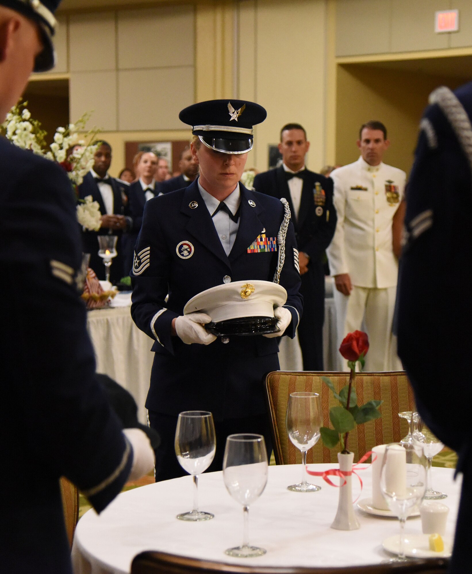 Tech. Sgt. Heather Starnes, Keesler Honor Guard member, participates in a POW/MIA table ceremony during the U.S. Air Force 70th Birthday Ball at the Bay Breeze Event Center Sept. 16, 2017, on Keesler Air Force Base, Mississippi. The event, hosted by the 81st Training Wing and the John C. Stennis Chapter of the Air Force Association, also paid tribute to all prisoners of war and military members still missing in action. (U.S. Air Force photo by Kemberly Groue)