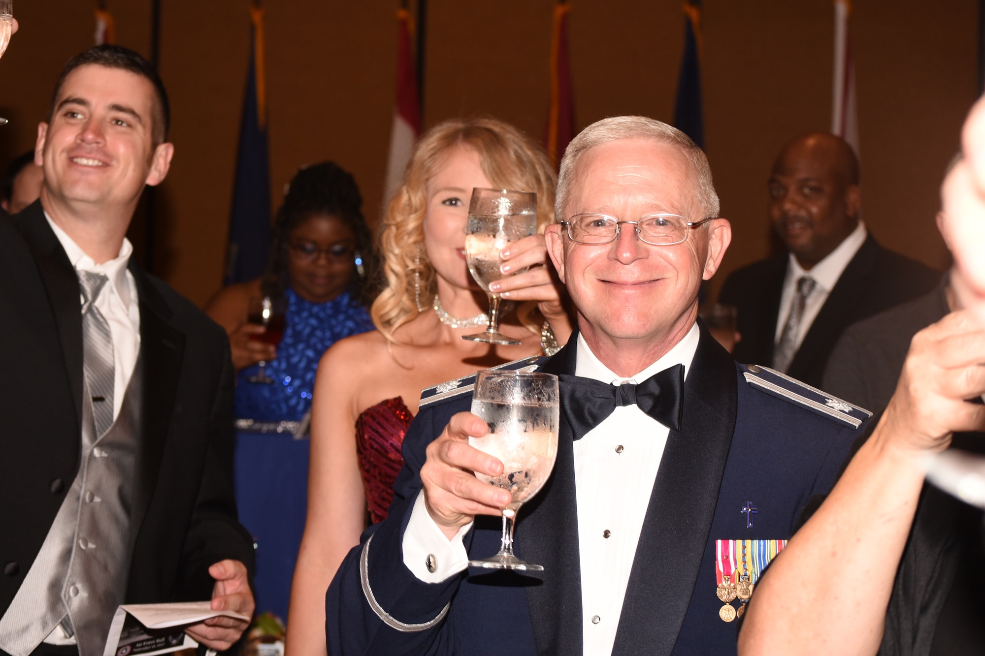 While attending the Air Force Ball last Saturday, Chaplain (Lt. Col.) Sam Tucker raised his glass during the toasts.