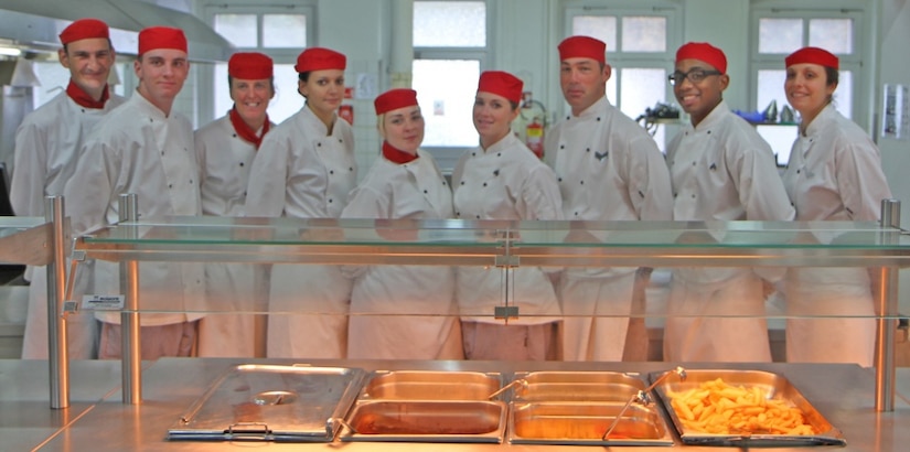 Cooks prepare food in one of the kitchens located at Sennelager Training Area, Germany.