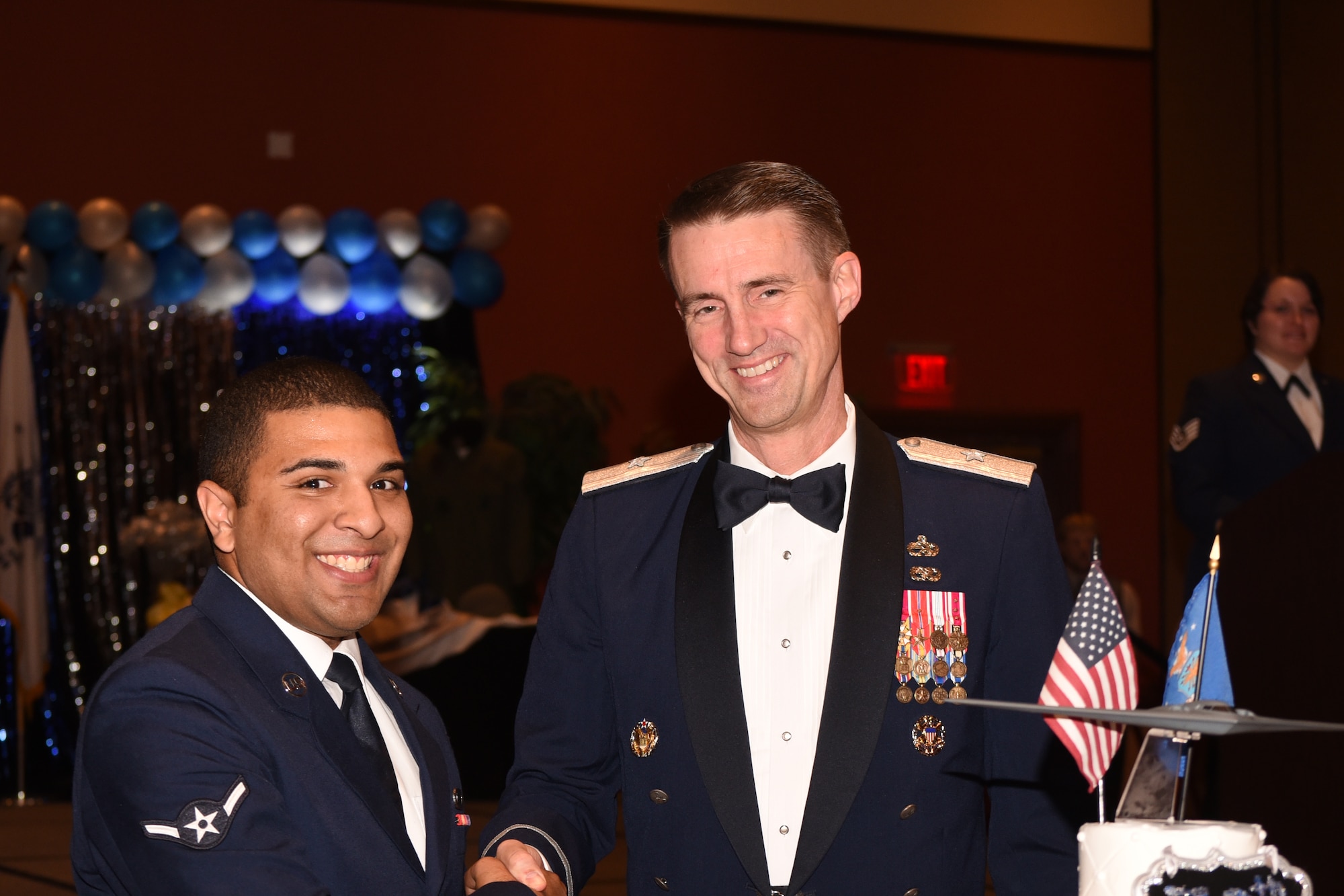 Brig. Gen. Tom Miller, commander of the Oklahoma City Air Logistics Complex, cut the ceremonial birthday cake along with Airman William Parker from the 72nd Air Base Wing Comptroller Squadron.