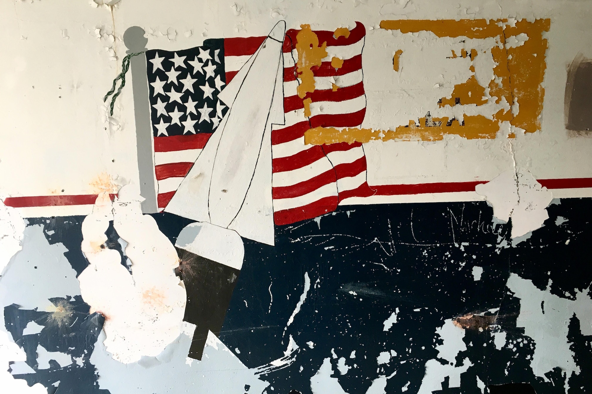 The chipped fragments of a mural remain on the missile launch and storage area at Nike Site Summit, at Joint Base Elmendorf-Richardson, Alaska, Sept. 9, 2017. Nike Site Summit was constructed in 1959 as a response to the advanced Soviet bombers of the 1950s. The site was then decommissioned in 1979.