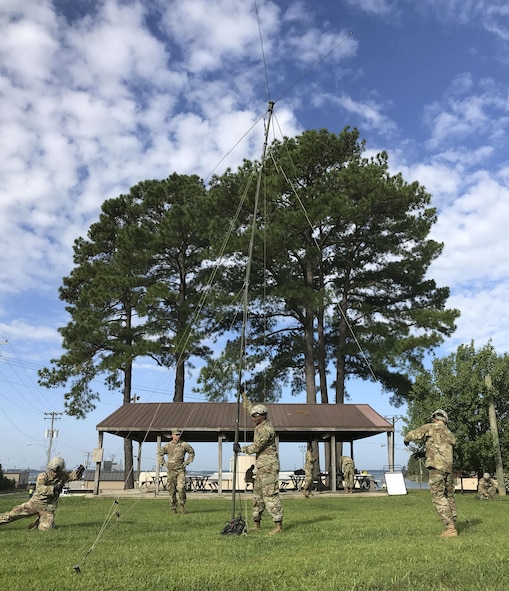 U.S. Army Soldiers assigned to the 558th Transportation Company, 10th Transportation Battalion, 7th Transportation Brigade (Expeditionary) set up an OE-254 radio antenna during the company’s first “Maintenance Rodeo” competition at Third Port, Joint Base Langley-Eustis, Va., Sept. 20, 2017.