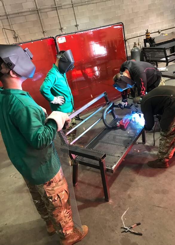 U.S. Army Soldiers assigned to the 558th Transportation Company, 10th Transportation Battalion, 7th Transportation Brigade (Expeditionary) fabricate a steel bench during the company’s first “Maintenance Rodeo” competition at Third Port, Joint Base Langley-Eustis, Va., Sept. 20, 2017.