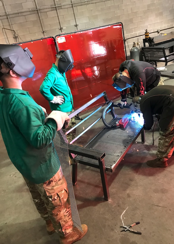 U.S. Army Soldiers assigned to the 558th Transportation Company, 10th Transportation Battalion, 7th Transportation Brigade (Expeditionary) fabricate a steel bench during the company’s first “Maintenance Rodeo” competition at Third Port, Joint Base Langley-Eustis, Va., Sept. 20, 2017.