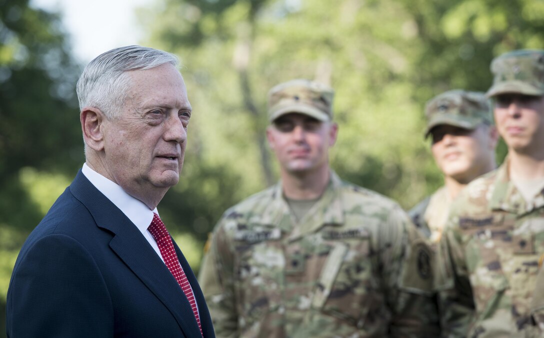 Defense Secretary Jim Mattis stands with a group of soldiers.