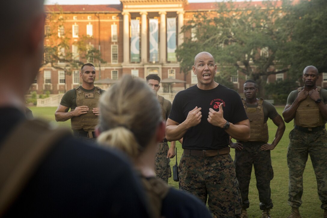 Marine Corps Master Sgt. Bryan Smith, assistant Marine officer instructor for Tulane University, talks to Naval Reserve Officers Training Corps midshipmen after a morning workout at Tulane University in New Orleans, Sept. 20, 2017.